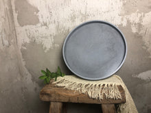 Load image into Gallery viewer, A round concrete tray, handmade for your indoor or outdoor space. Shown here in concrete gray.
