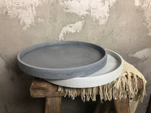 Load image into Gallery viewer, A round concrete tray, handcrafted for your indoor or outdoor space.

